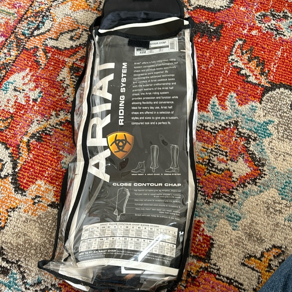 BRAND NEW ARIAT CHAPS. Size xsm